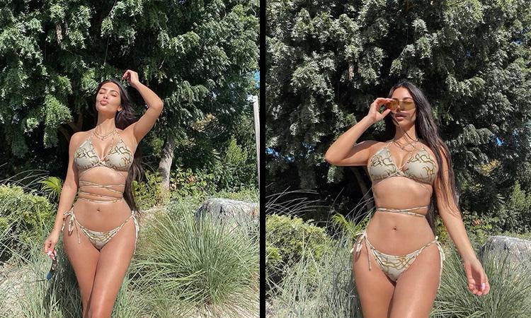 Kim Kardashian flaunts tiny waist in tieup bikini