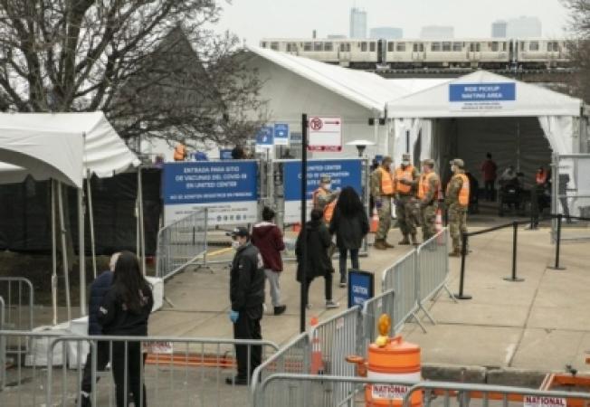 People-standing-in-queue-to take-jabs