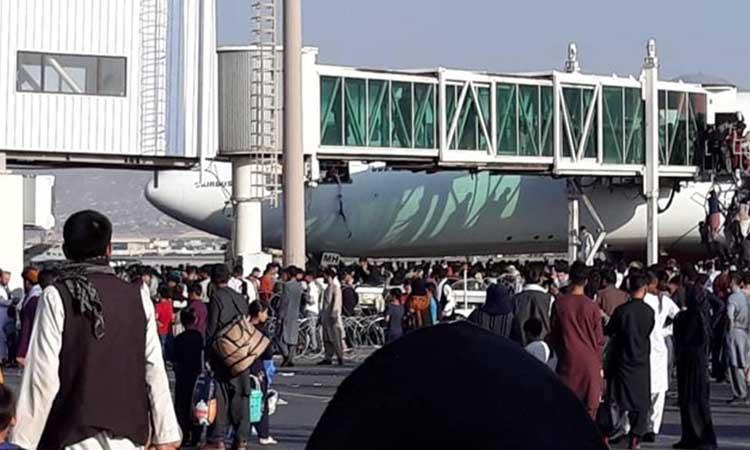 Chaos as people running onto Kabul airport runways to board flights