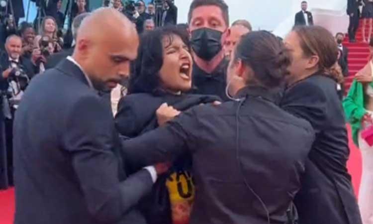 Woman-protesting-Ukraine-sexual-violence-removed-from-Cannes-red-carpet