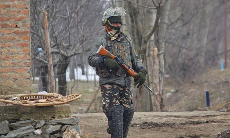 A-soldier-at-the-site-of-an-encounter-with-militants-in-Jammu-and-Kashmir