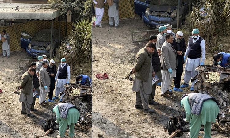 Security-personnel-investigate-at-the-site-of-a-suicide-attack-in-Pakistan-capital-Islamabad