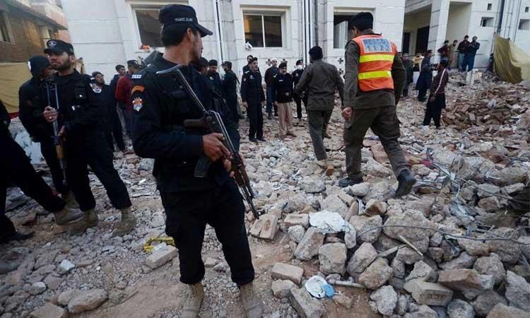 Security-personnel-inspect-a-mosque-after-a-blast-in-Peshawar