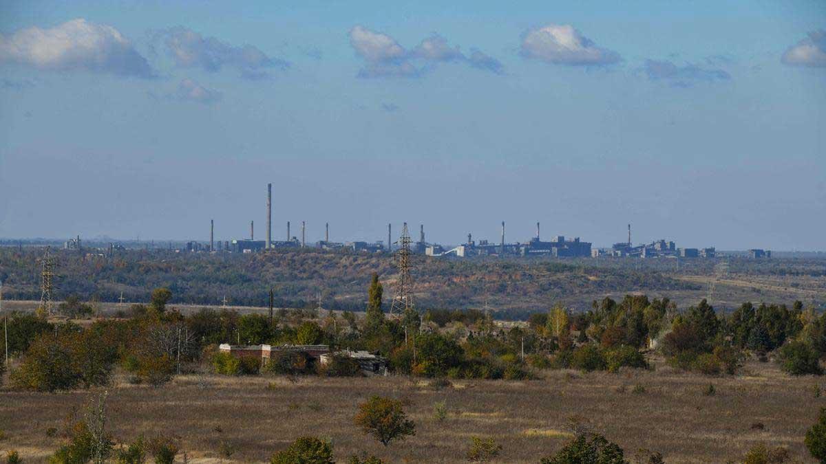 Smoke rises over an industrial site in Avdiivka