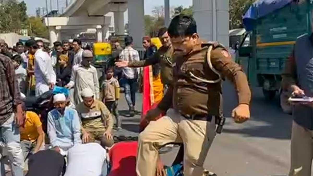 Sub-inspector-Manoj-Kumar-Tomar-was-suspended-after-his-video-of-kicking-Muslims-while-they-were-offering-namaz-on-Friday-went-viral.