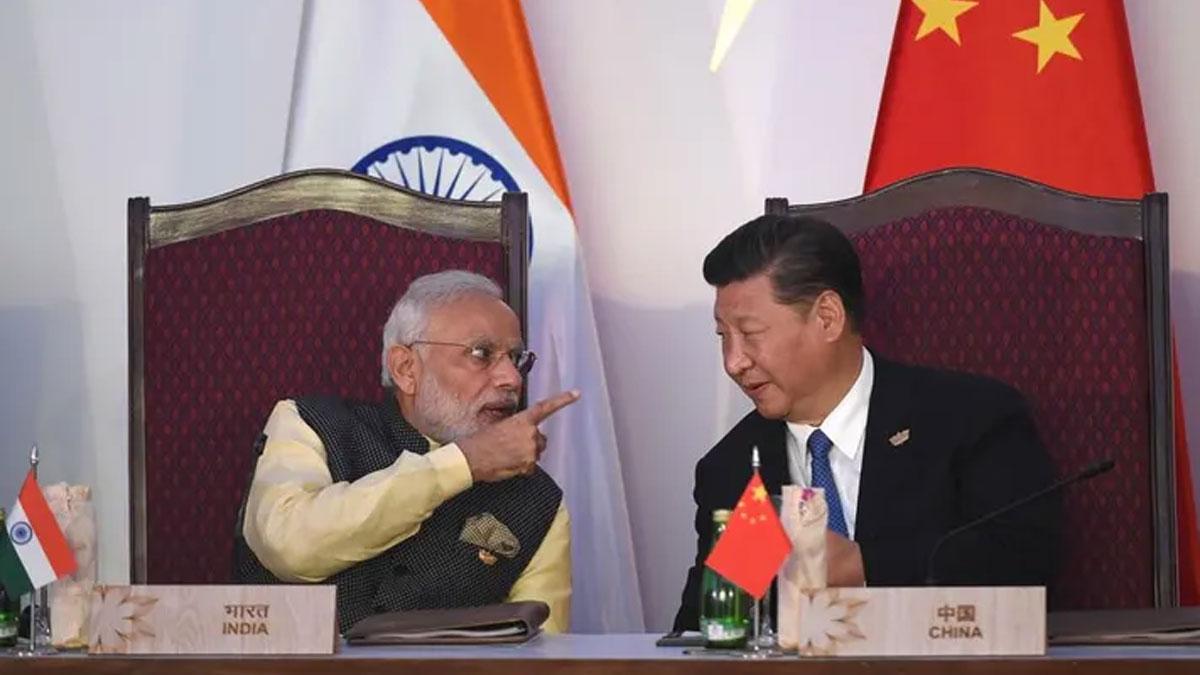 India-Prime-Minister-Narendra-Modi-(L)-gestures-while-talking-with-China's-President-Xi-Jinping