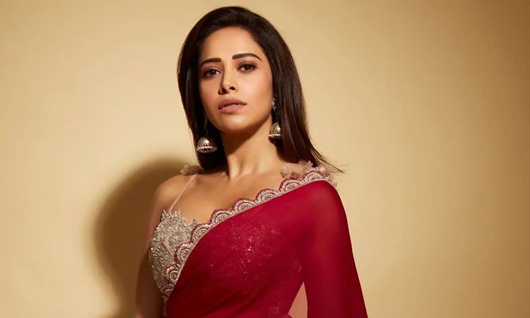 Nushrratt Bharuccha flaunts her curves in bold red saree